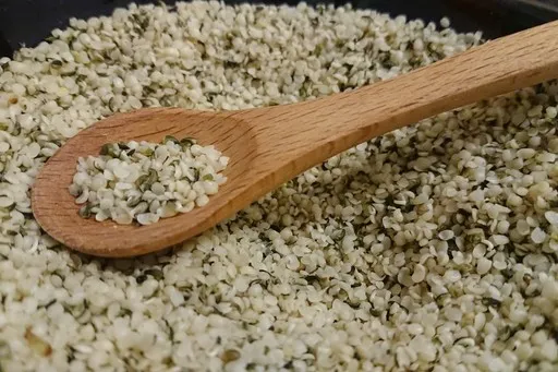 Hemp seeds in a wooden bowl